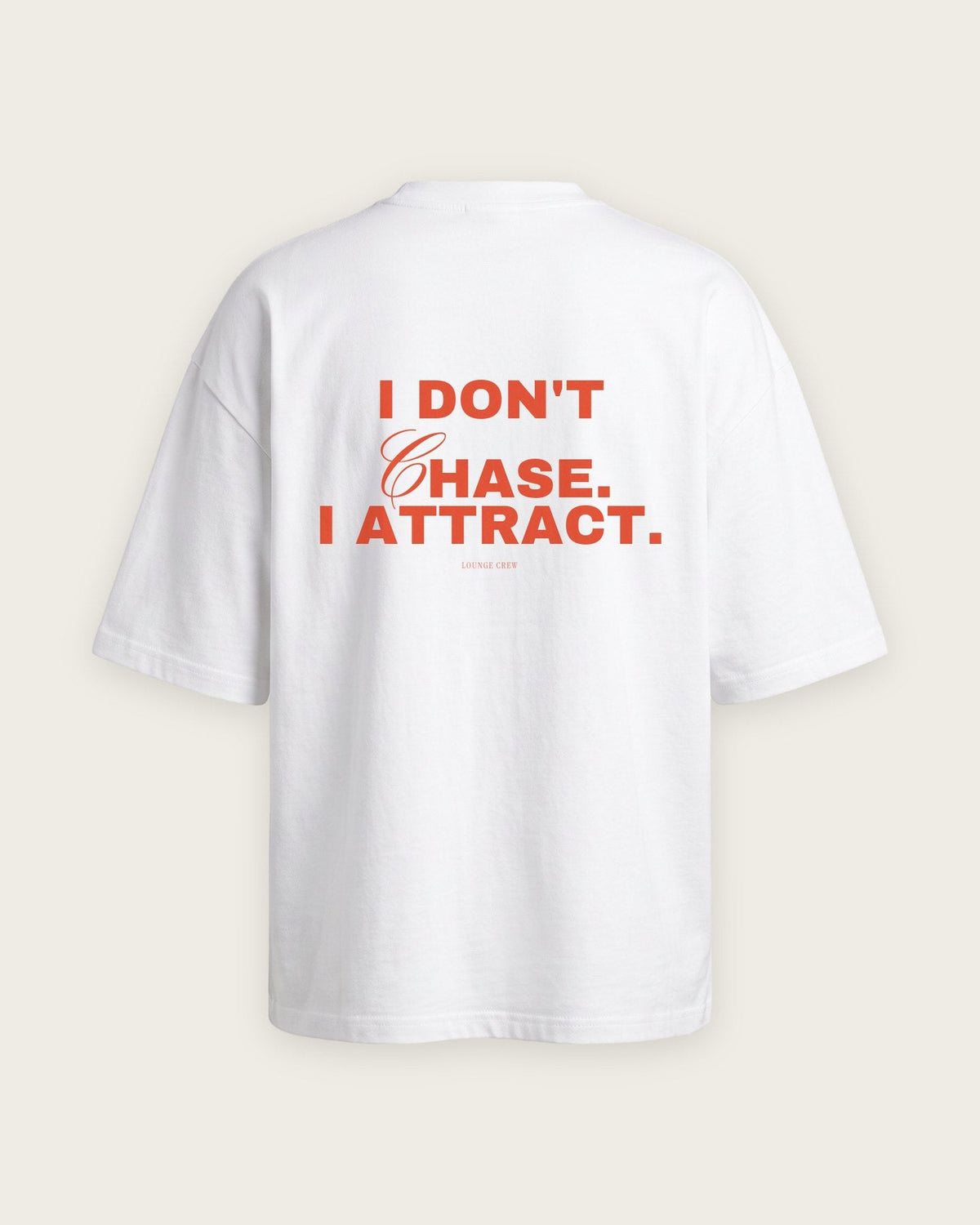 Camiseta Oversized “I Don't Chase, I Attract” — Branco